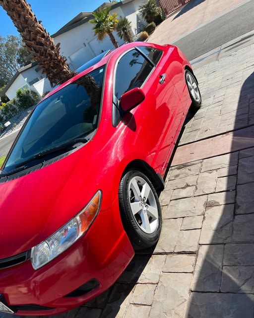 Red Civic with a polished finish
